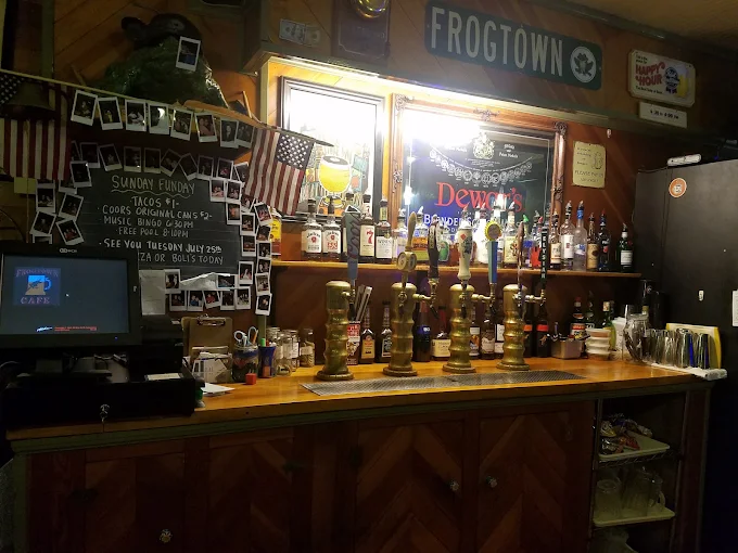 Inside Frogtown — the bar, the taps, the chalkboard specials and a wall of Polaroids